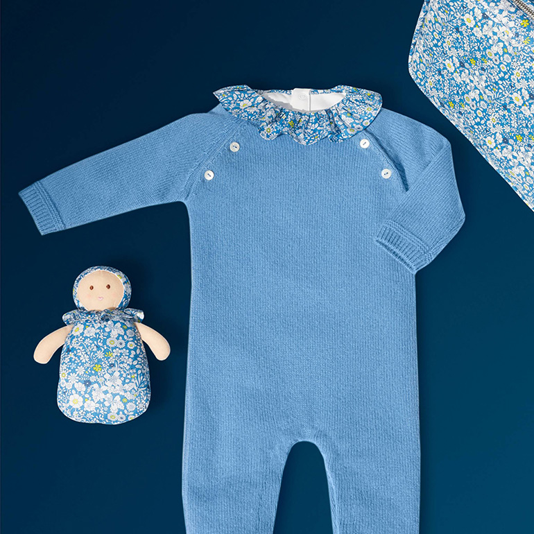 Shop the baby jumpsuit in blue cashmere with matching Liberty kit